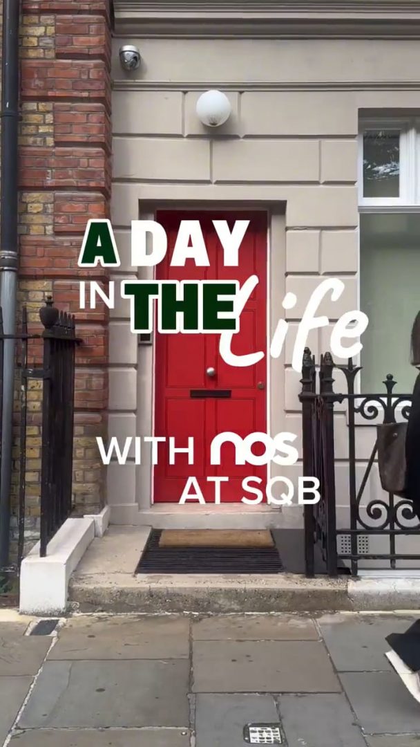 Nos › red front door of a townhouse with bold white and green text overlay reading 'a day in the life' (video frame).